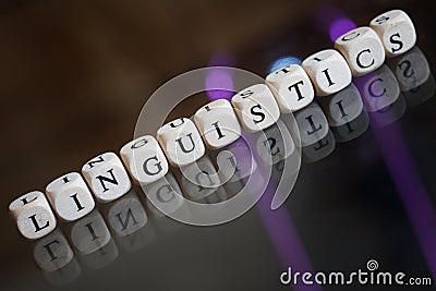 The word linguistics is laid out in wooden cubes on a reflective surface. Concept for modern language sciences, computational Stock Photo