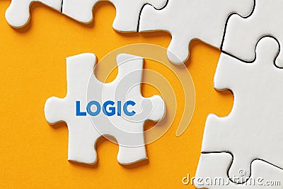The word logic on a puzzle piece. Logical thinking, problem solving, cognition or attitude Stock Photo
