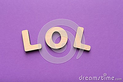 LOL abbreviation spelled with wooden letters Stock Photo