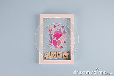 Word love and hearts on blue background. Valentine`s Day background. Valentines day, Mothers day, Womens day , wedding Stock Photo