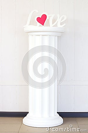 The word love on a pedestal Stock Photo