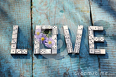 Word love of wooden dominoes Stock Photo