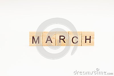 Word MARCH made of wooden blocks on white background. Month of year Stock Photo
