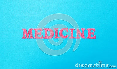 Word medicine made of red letters on a blue background. The concept of varieties of medicine military and space medicine Stock Photo