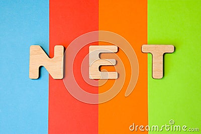 Word NET composed of 3D letters is in background of 4 colors: blue, red, orange and green. Domain designation or framework, short Stock Photo