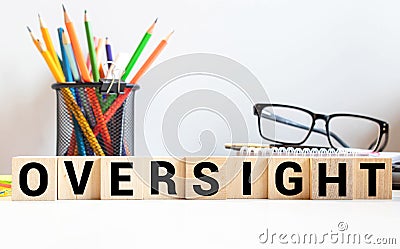 word Oversight on wooden block, concept business Stock Photo