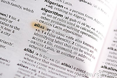 The word or phrase Alias in a dictionary Stock Photo