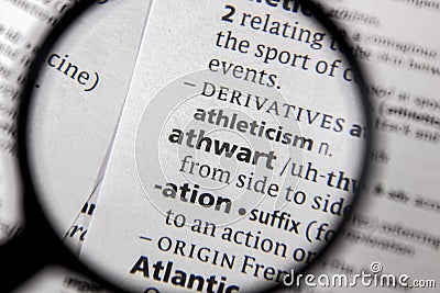 The word or phrase athwart in a dictionary Stock Photo