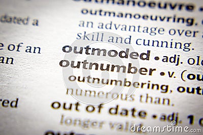 Word or phrase Outmoded in a dictionary Stock Photo