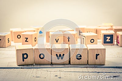 Word ` power ` wood Cubic on the wood Stock Photo