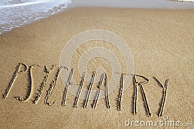 Word psychiatry in the sand of a beach Stock Photo