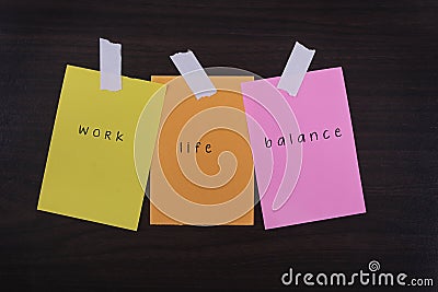 Word quotes of work life balance on colorful sticky papers against wooden textured background Stock Photo