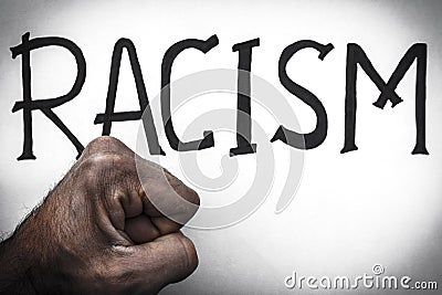 Word Racism and male fist African. Concept of racial discrimination. Stop racism and nationalism. Equality of races Stock Photo