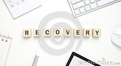 Word Recovery on wooden cubes with a business objects Stock Photo