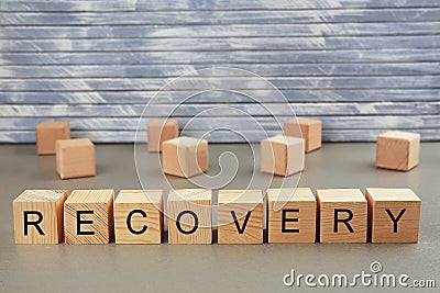 Word recovery written on wooden blocks Stock Photo