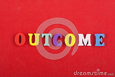 OUTCOME word on red background composed from colorful abc alphabet block wooden letters, copy space for ad text. Learning english Stock Photo