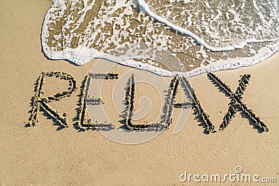 Word relax on beach Stock Photo