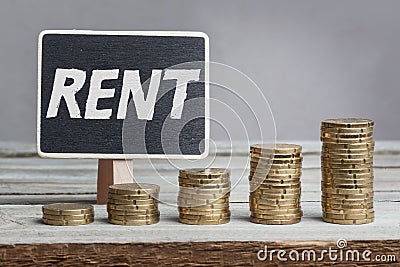 Word Rent with coin stacks Stock Photo