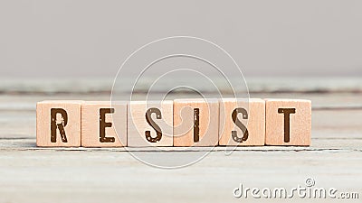 Word Resist on six wood cubes Stock Photo