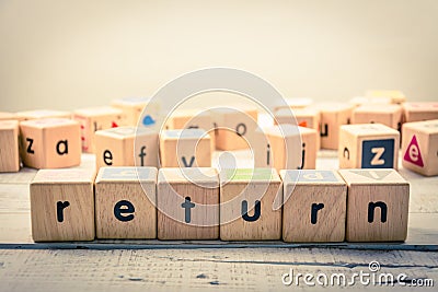 Word ` return ` wood Cubic on the wood Stock Photo