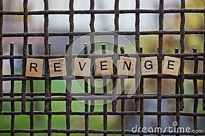 The word revenge from wooden letters Stock Photo