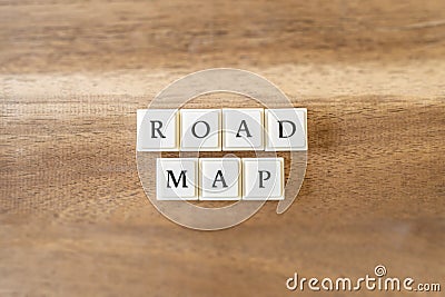The word Road Map on a wooden background. Stock Photo