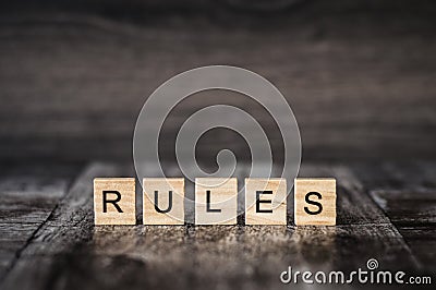 The word rules made of bright wood cubes with black letters on a Stock Photo