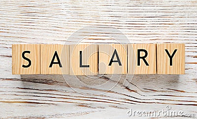 Word Salary made with cubes on white wooden table, flat lay Stock Photo