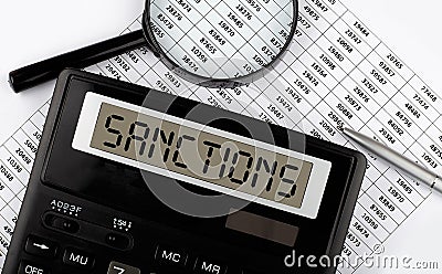 Word SANCTIONS on the calculator. Business concept Stock Photo