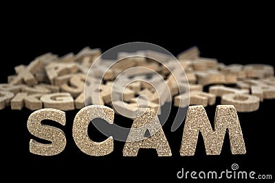 Word scam in cork letters Stock Photo