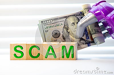 The word SCAM on wood toy blocks Stock Photo