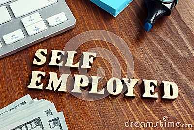 Word self employed on an office desk Stock Photo