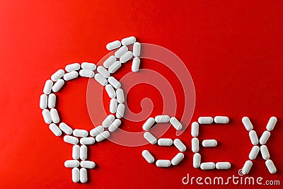 The word sex with capsules and pills with treatments for erectile dysfunction. Stock Photo