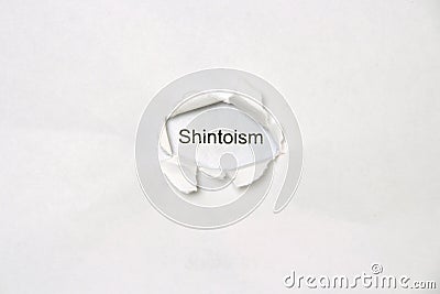 Word Shintoism on white isolated background through the wound hole in the paper. Stock Photo