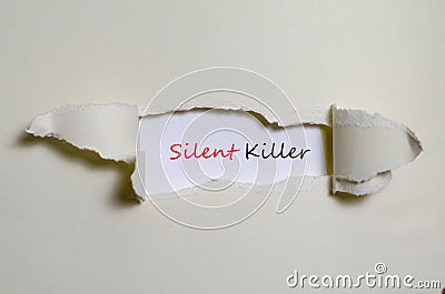 The word silent killer appearing behind torn paper Stock Photo