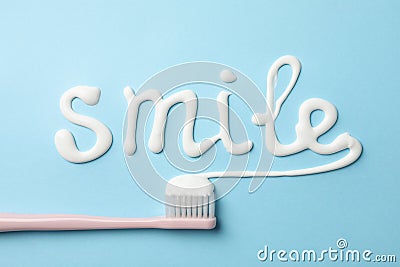 Word Smile made of toothpaste on background, top view Stock Photo