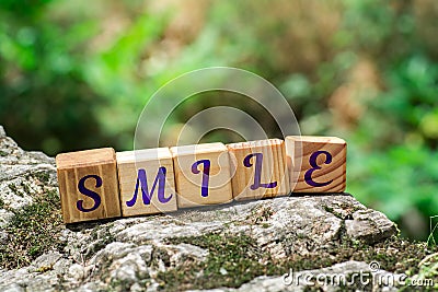 Word smile on stone Stock Photo