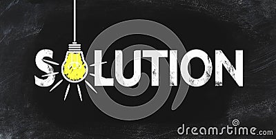Word SOLUTION an blackboard with blowing light bulb symbolizing an idea Stock Photo