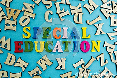 The word `special education` is laid out from multicolored letters on a blue background Stock Photo