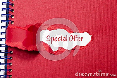 The word special offer appearing behind torn paper Stock Photo