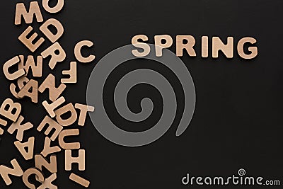 Word Spring with heap of wooden letters Stock Photo
