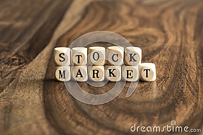 Word STOCK MARKET on wooden cubes Stock Photo