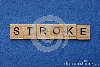 Word stroke made from brown wooden letters Stock Photo