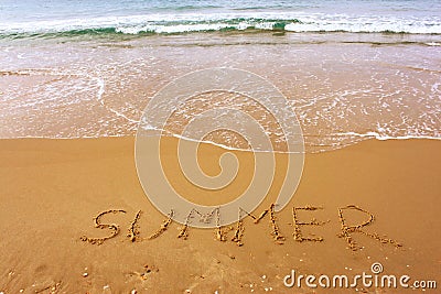 Word summer written on beach sand Stock Photo