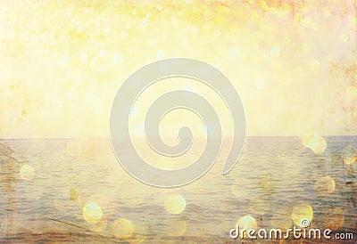 The word summer written on beach sand and gliiter golden lights. Stock Photo