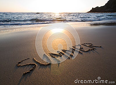 Word summer written in the sand Stock Photo