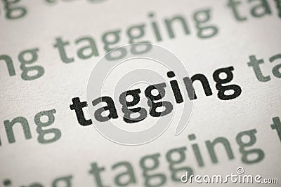 Word tagging printed on paper macro Stock Photo