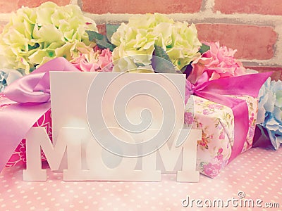 Word text mom and gif box present with space copy backgroud made with vintage filter color Stock Photo