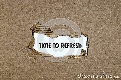 The word time to refresh appearing behind torn paper Stock Photo