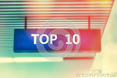 Word TOP 10 on advertising board with shiny bright colors Stock Photo